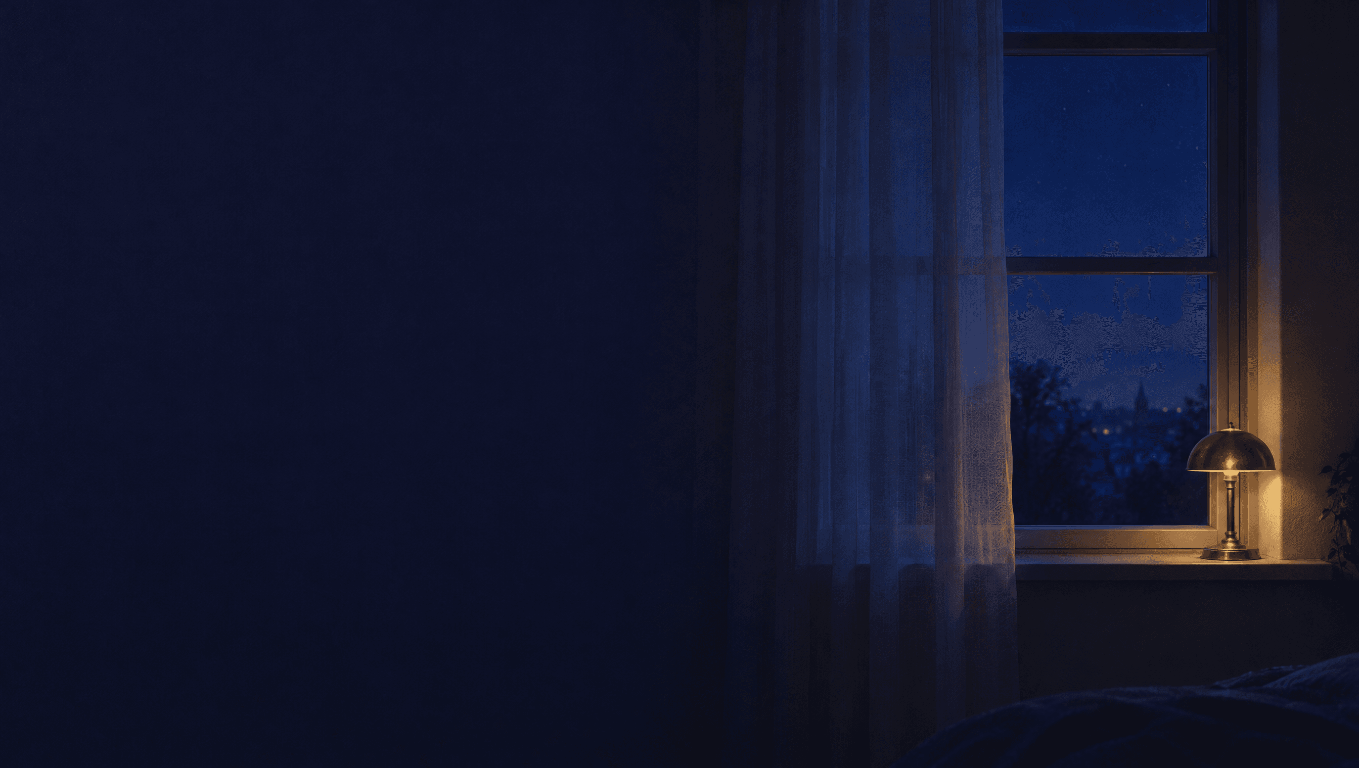 A dark bedroom window at night with a sheer curtain and one lit lamp